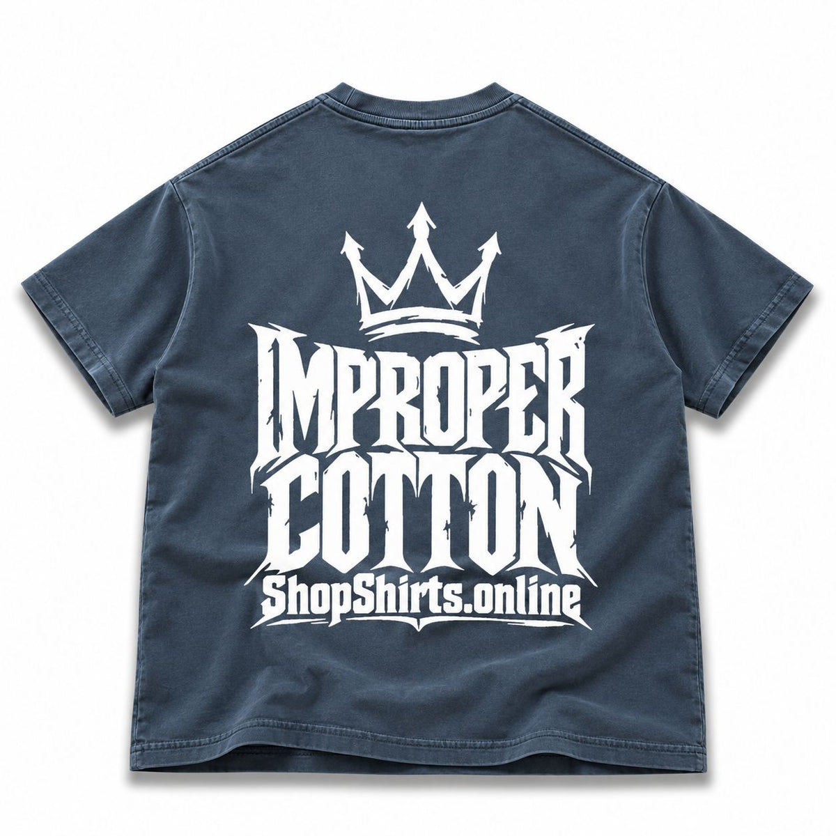 Back of Improper Cotton blue vintage wash oversized T-shirt featuring a distressed white crown logo, bold Improper Cotton lettering and ShopShirts.online graphic, alternative streetwear shirt, oversized graphic tee, vintage washed streetwear, gothic logo T-shirt and unisex urban clothing