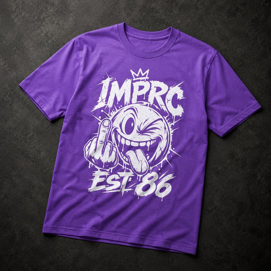 A purple short-sleeve t-shirt with a white graphic print featuring a cartoon face, a crown, and the text 'IMPRO EST 86', laid flat on a dark textured background.