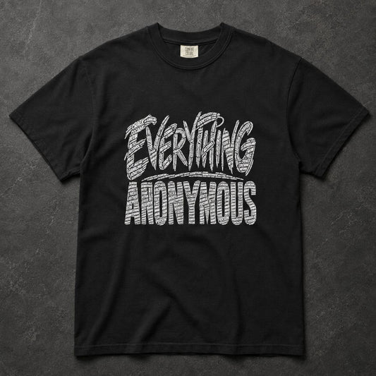 A black short-sleeve t-shirt with a white textured graphic reading 'EVERYTHING ANONYMOUS' across the chest, laid flat on a dark gray textured background.