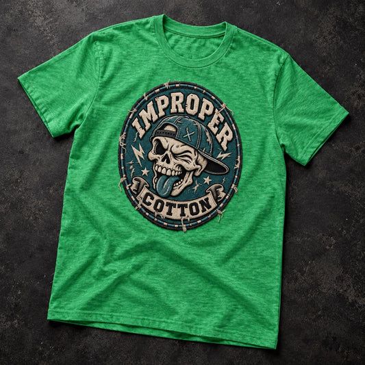 A green heather crewneck t-shirt featuring a circular graphic print of a skull wearing a cap with the words 'IMPROPER' and 'COTTON' on a dark textured background.