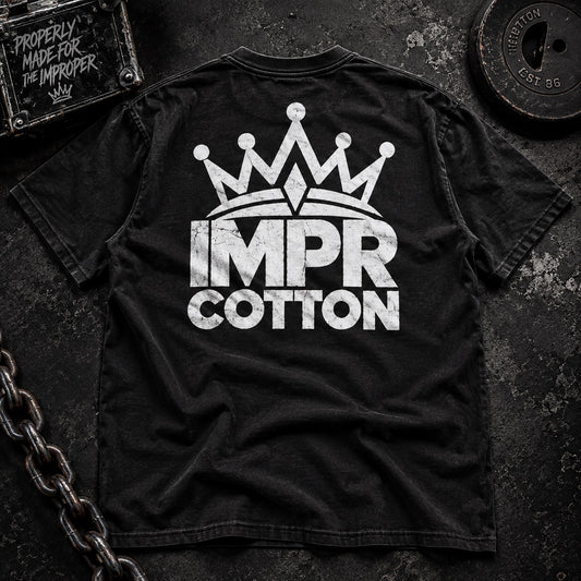 Back of white lines matter black graphic tee with white impr cotton crown logo laying on a table by improper cotton 