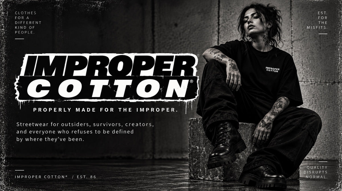 A black and white promotional graphic for Improper Cotton streetwear, featuring a tattooed person sitting on a concrete block against a dark wall, wearing a black t-shirt and pants. The brand name 'IMPROPER COTTON' is displayed in large distressed white and black letters on the left, with additional brand text and slogans around the composition.