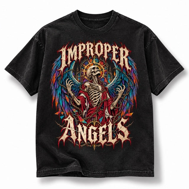 Black vintage wash Improper Angels T-shirt featuring a detailed skeletal angel with colorful wings, thorn accents, gothic IMPROPER ANGELS lettering and distressed artwork, displayed solo on a clean white background with a soft natural shadow.