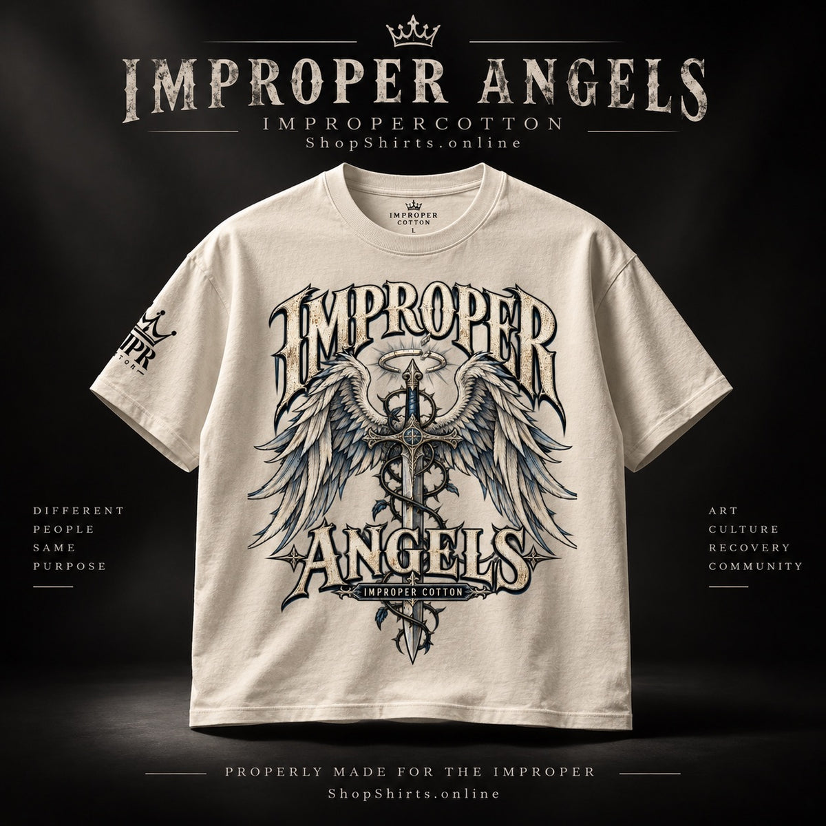 A cream-colored t-shirt with a large gothic-style graphic reading 'IMPROPER ANGELS' around a central winged cross, displayed against a dark background with 'IMPROPER ANGELS' branding at the top.