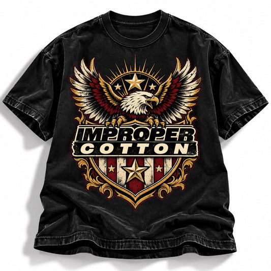 A black washed graphic t-shirt featuring an eagle design with the text 'IMPROPER COTTON' on a white background.