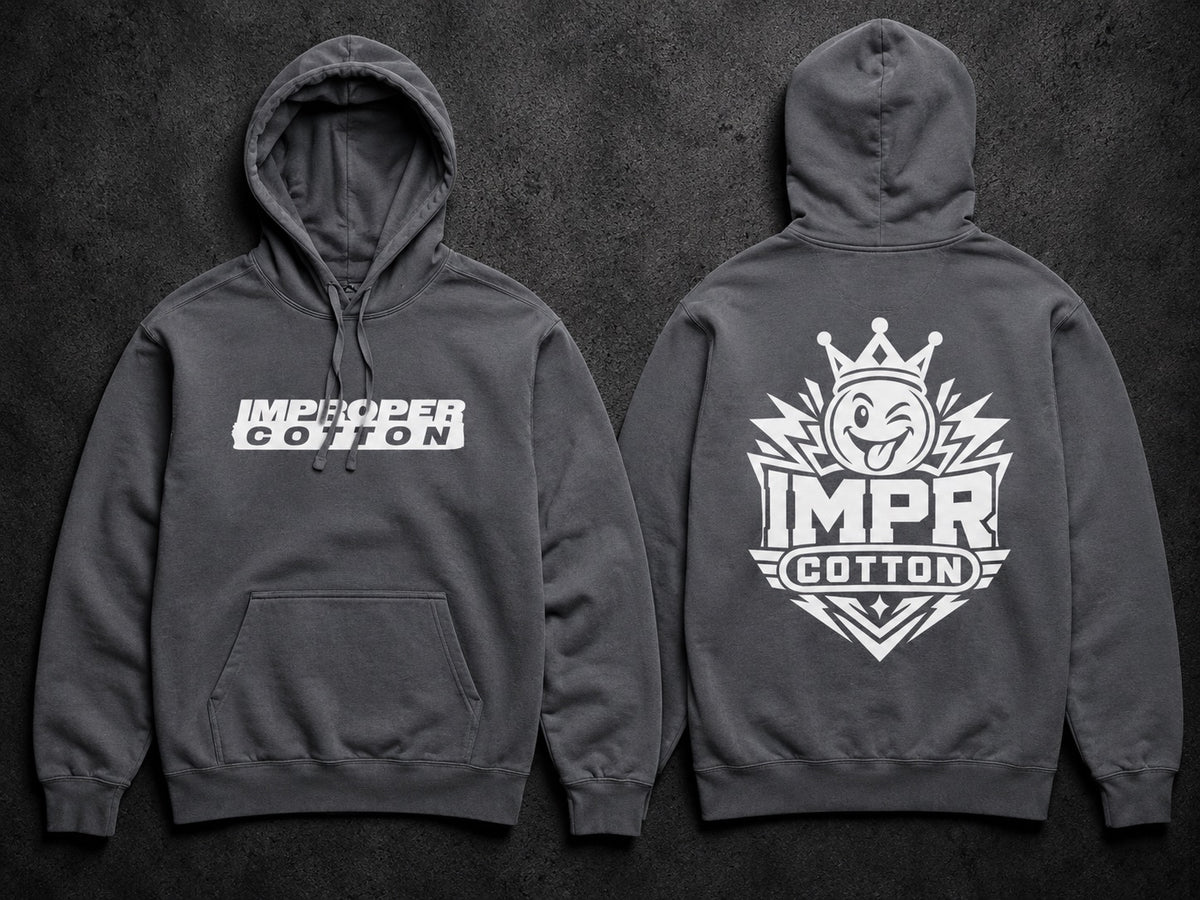 Dark gray pullover hoodie shown from both front and back on a dark textured background. The front has a white 'IMPROPER COTTON' logo across the chest, and the back features a large white graphic with a crown, lightning, and 'IMPR COTTON' text.