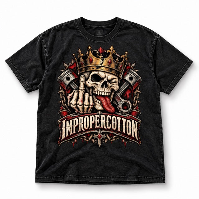 Black vintage-wash Improper Cotton T-shirt featuring a crowned skull with pistons, chains, middle finger graphic, and distressed gothic branding