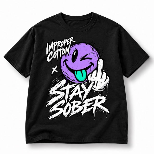 Black Improper Cotton Stay Sober T-shirt featuring a distressed purple winking smiley with teal tongue, middle finger graphic, and bold white graffiti lettering, shown solo on a clean white background with a soft shadow.