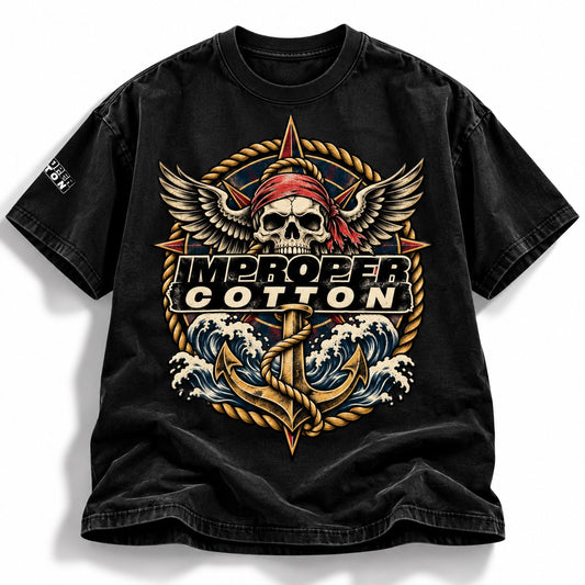 A black short-sleeve graphic t-shirt featuring a large front print with a skull wearing a red bandana, wings, rope, waves, an anchor, and the text 'IMPROPER COTTON'.