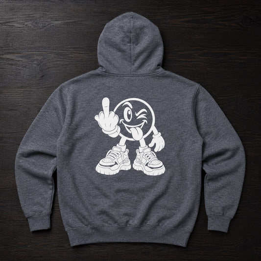 A dark heather gray hoodie shown from the back, featuring a large white graphic of a cartoon face wearing sneakers and gesturing with one hand, laid flat on a dark wood background.