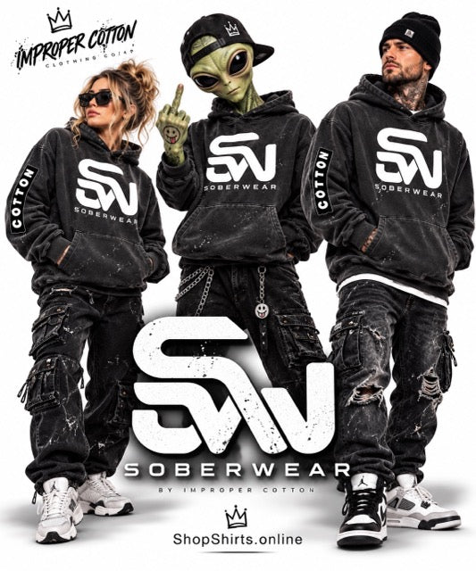 Three models wearing matching black Soberwear hoodies and distressed cargo pants, posed against a white studio background with large 'SW' and 'Soberwear' branding and 'Improper Cotton' text.
