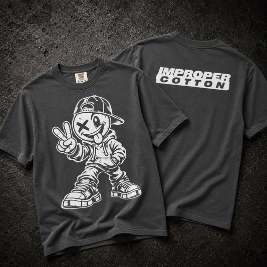 A dark charcoal gray t-shirt shown from both front and back. The front features a large white graphic of a cartoon character wearing a cap and giving a peace sign.