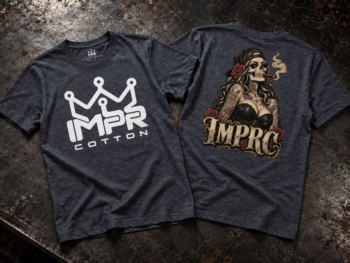 Two dark heather gray t-shirts displayed flat on a textured dark surface, showing the front and back designs. The front features a white crown logo above the text 'IMPR' and 'COTTON'.