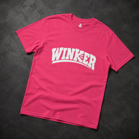 A bright pink short-sleeve t-shirt with 'WINKER' printed in bold white arched letters across the chest, laid flat on a dark textured background.