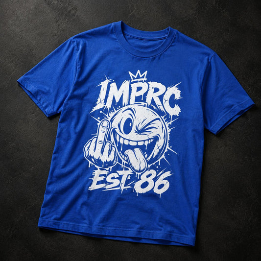 A royal blue short-sleeve t-shirt with a white graphic print featuring a cartoon character and the text 'IMPRC EST. 86', laid flat on a dark textured background.