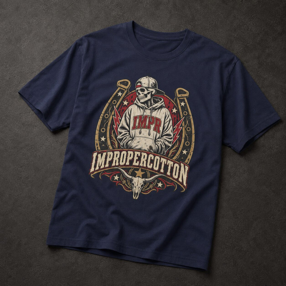 A navy blue short-sleeve t-shirt with a large western-style graphic on the front. The graphic features a skeleton wearing a cap and hoodie with 'IMPR' on the chest, framed by a horseshoe, with a skull and the words 'IMPROPERCOTTON' below.