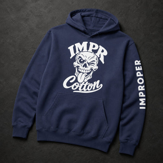 A navy blue pullover hoodie with a white graphic print on the front showing a skull and the text 'IMPR Cotton', plus 'IMPROPER' printed vertically down one sleeve, displayed on a dark textured background.
