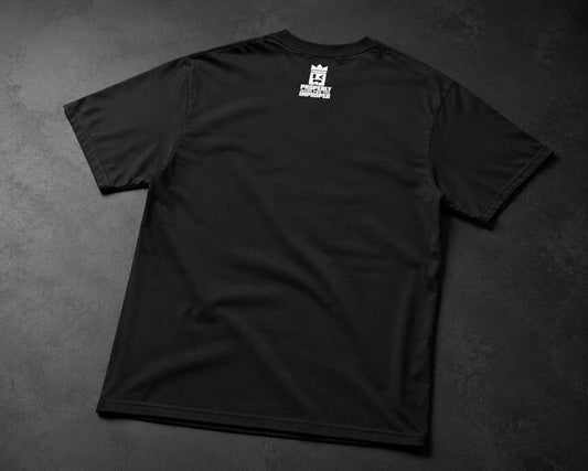 A black short-sleeve t-shirt laid flat on a dark textured gray background, featuring a small white graphic logo printed on the upper back.