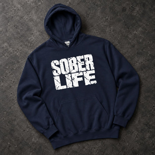 A navy blue pullover hoodie with a distressed white 'SOBER LIFE' graphic printed on the chest, laid flat on a dark textured gray background.