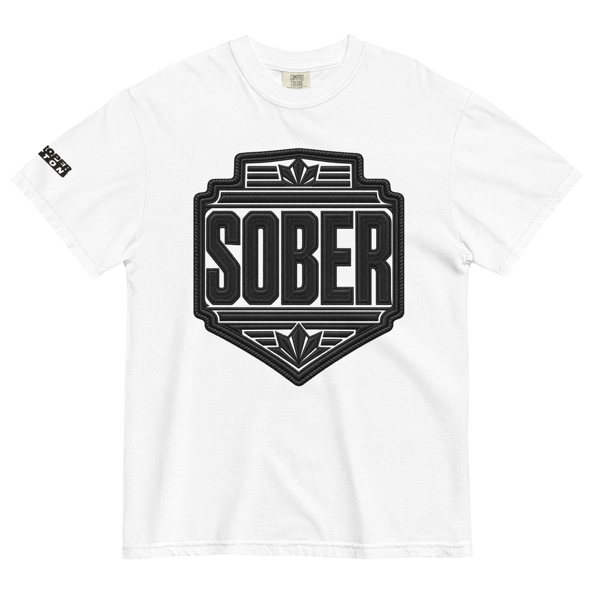 A white short-sleeve crewneck t-shirt featuring a large black shield-shaped graphic on the chest with the word 'SOBER' in bold letters, and a smaller black graphic on the left sleeve.