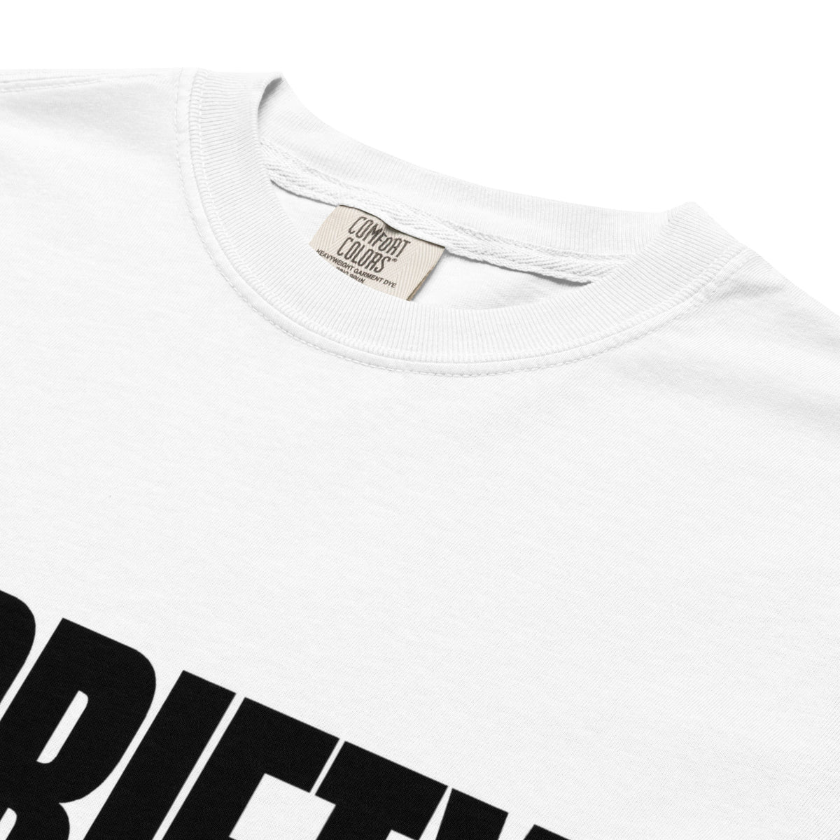 Close-up of a white crewneck t-shirt showing the inner neck label which reads 'COMBAT COLORS' and part of a large black graphic print at the bottom.
